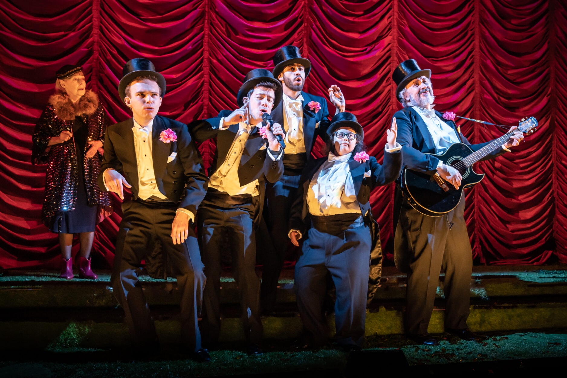 Eileen Nicholas, Maximilian Fairley, Philip Labey, Joseph Langdon, Faye Wiggan and Mark Benton in Village Idiot. Credit Marc Brenner.