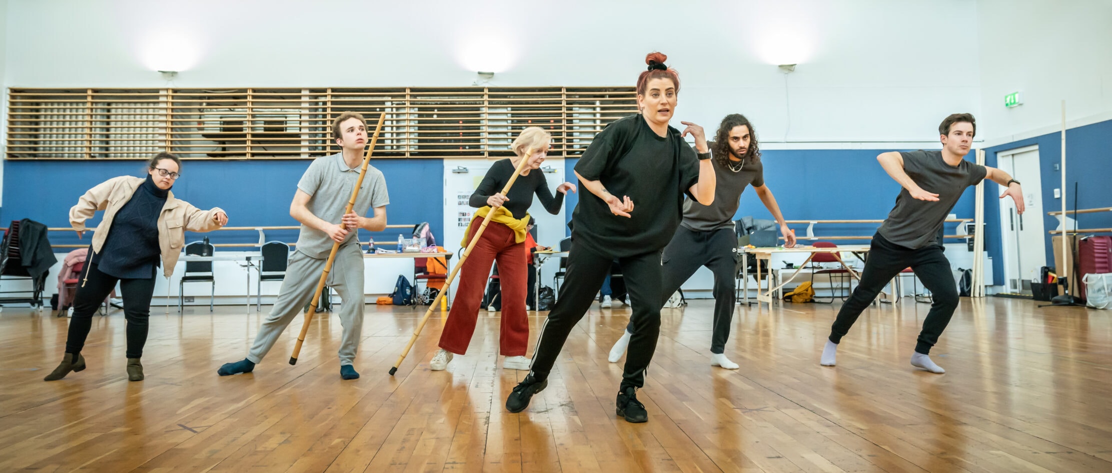 Cast & Carrie-Anne Ingrouille (Movement Director) in rehearsals for Village Idiot. Credit Marc Brenner