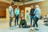 The cast in rehearsal for Minority Report, with Lucy Hind, Movement Director. Photo by Marc Brenner.