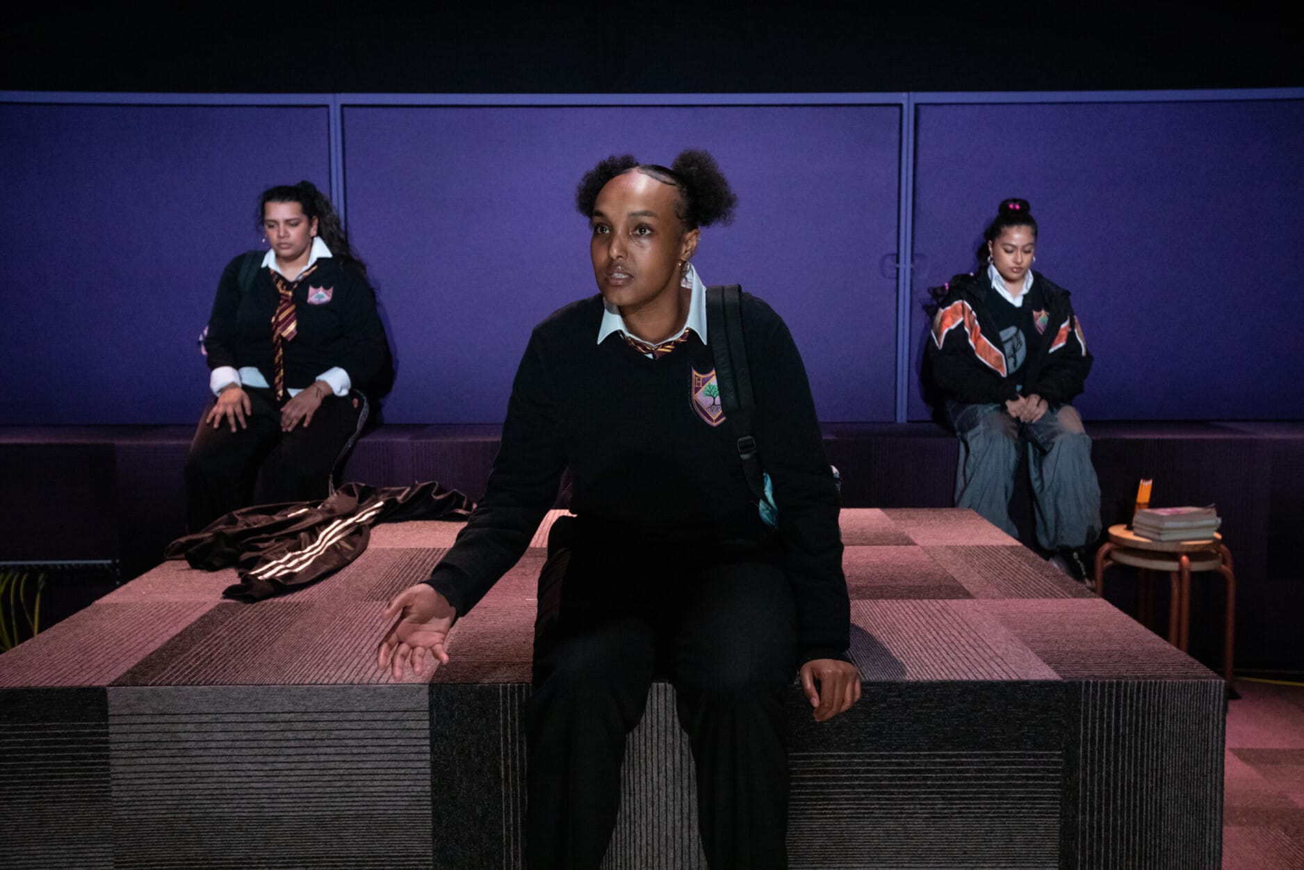 Asha Hassan as Sabi in Liberation Squares, with Vaneeka Dadhria as Ruqaya and Halema Hussain as Xara. Photo by Ali Wright.